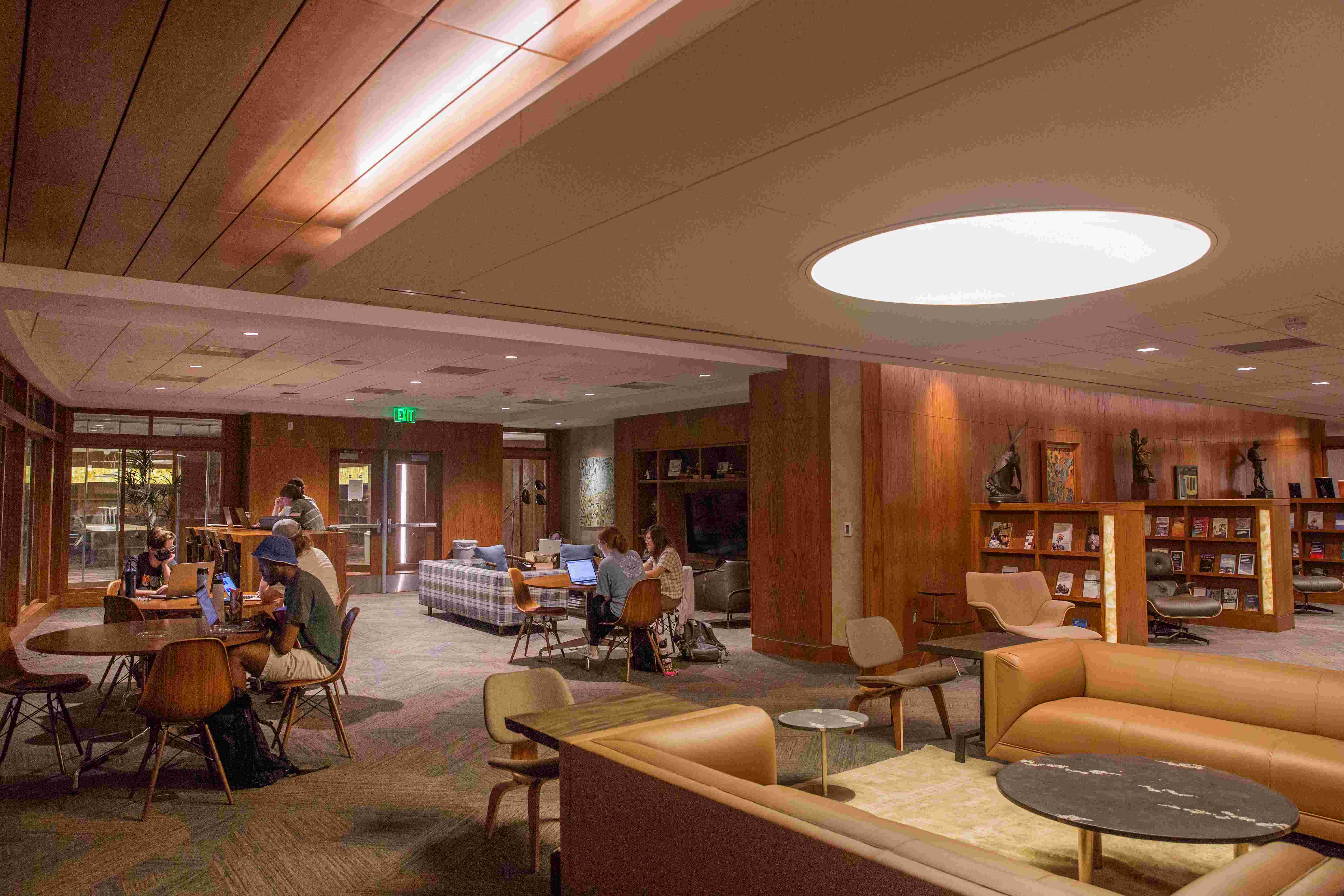 The Zarrow Center. The space has multiple couches, bookshelves, and seating areas with tables and chairs. 