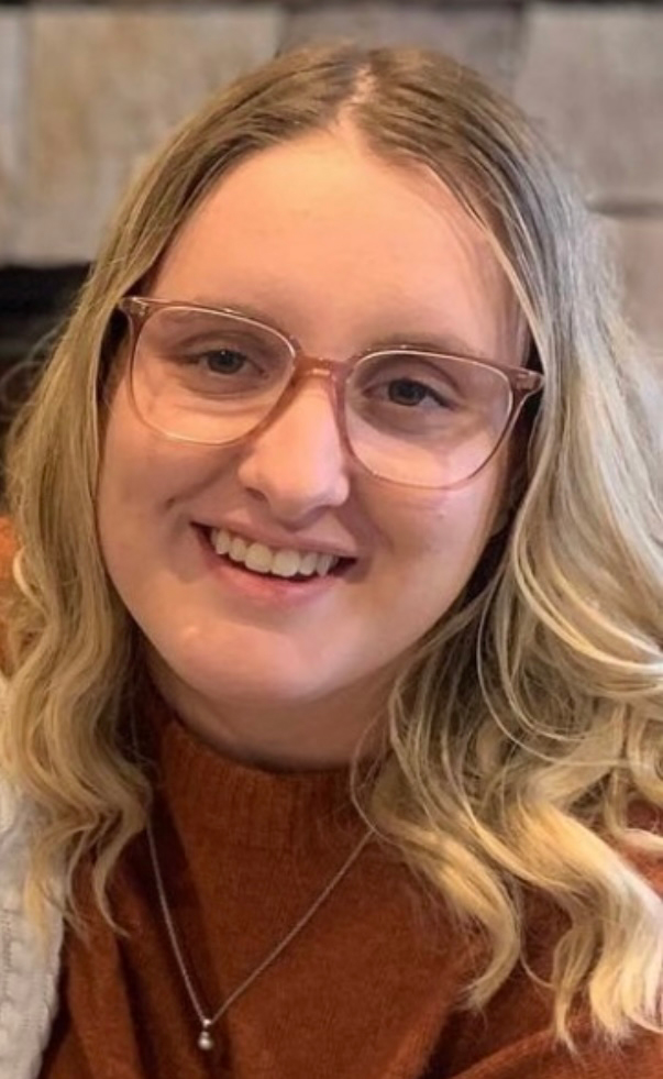 Brittley Hardisty has long blond hair and wears glasses and smiles for the camera.